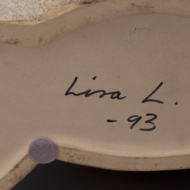 LISA LARSON, a stoneware figurine.