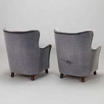 A pair of mid-20th century armchairs.