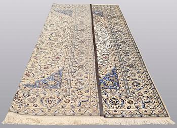 A carpet, Nain part silk, 364 x 256 cm.