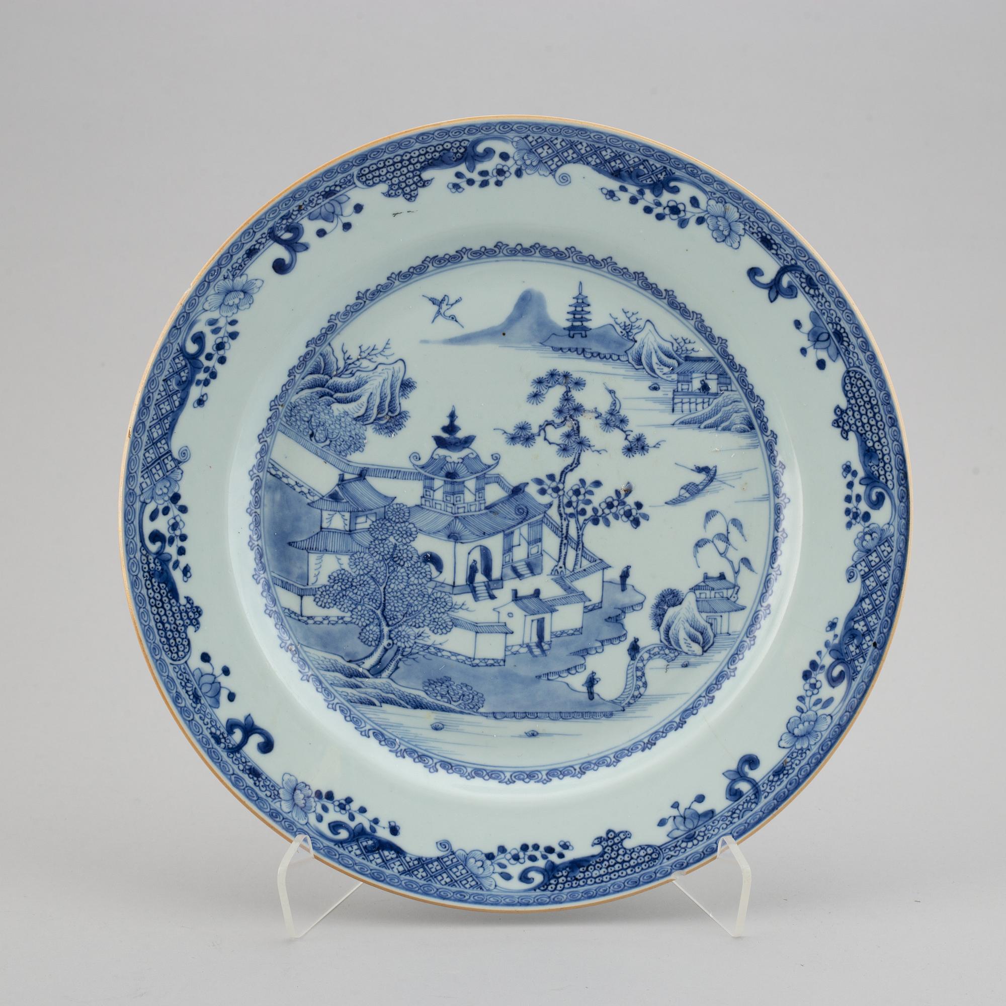 A blue and white serving dish and six odd blue and white plates, Qing dynasty, Qianlong (1736-95).