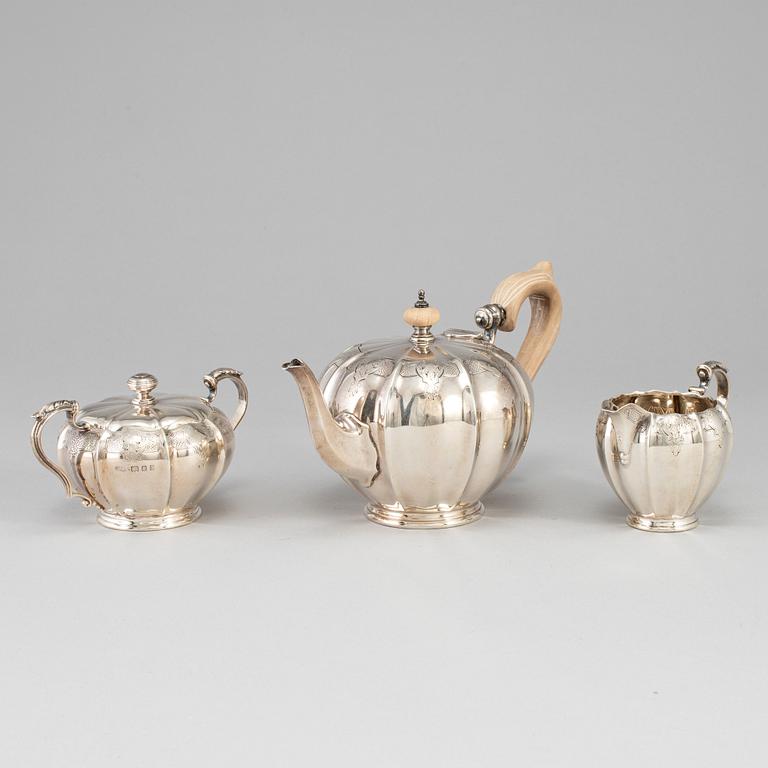 An English 20th century silver three piece tea-set, marked Crichton & Co Ltd, London 1925.