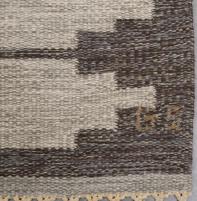 A signed flat weave carpet 220x160 cm.