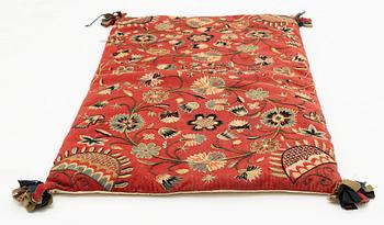An embroidered carrige cushion, c. 92 x 52 cm, Scania, Sweden, dated 1848.