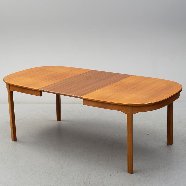 A second half of the 20th century table, two armchairs and six chairs "Ambassadör" by Carl Malmsten.