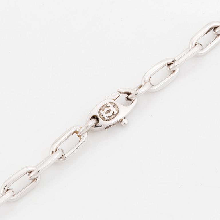 An 18K gold and white gold Cartier necklace with a charm.