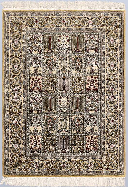 An Oriental silk rug, approx. 122 x 79 cm.