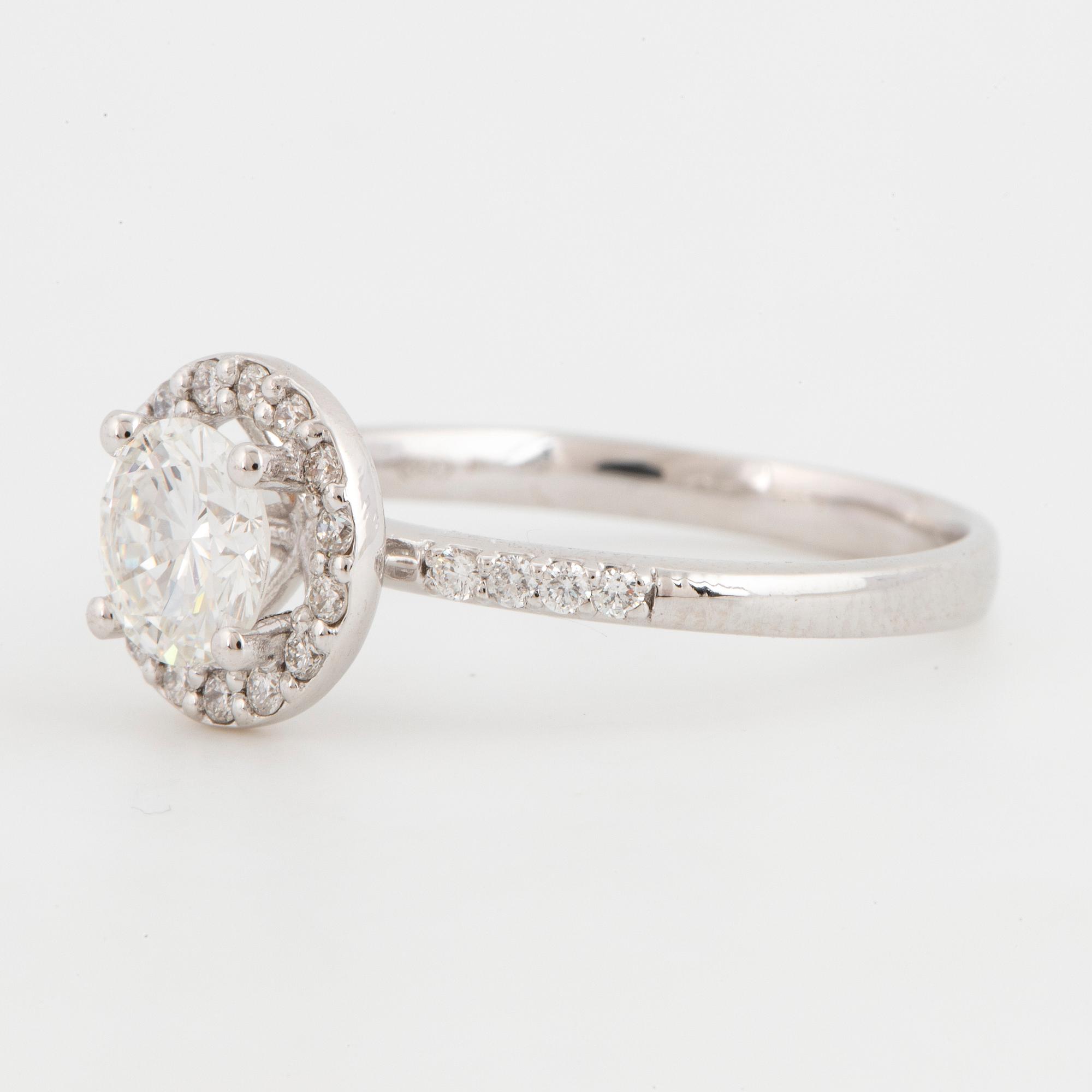 Brilliant-cut diamond halo ring.