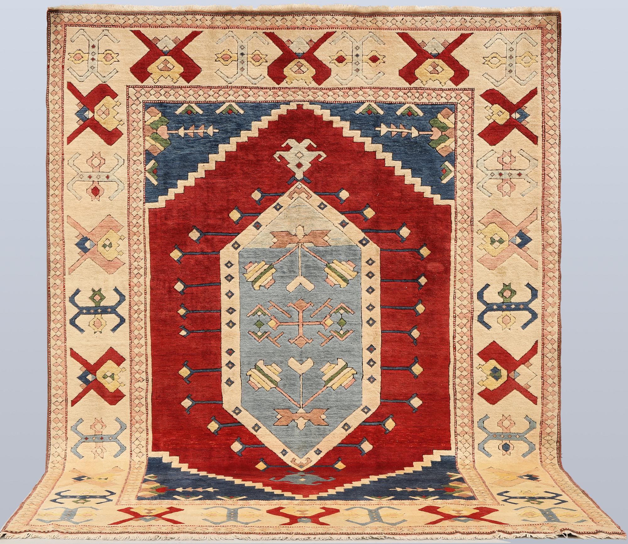 A semi-antique Anatolian Kars carpet, c. 302 x 236 cm.