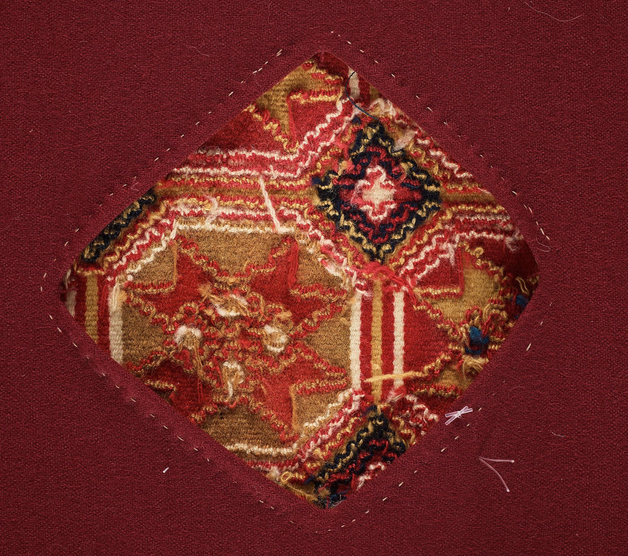 A CARRIAGE CUSHION, double-interlocked tapestry, "Stjärnmönster", ca 43,5-44,5 x 94-95 cm, Scania (Sweden).