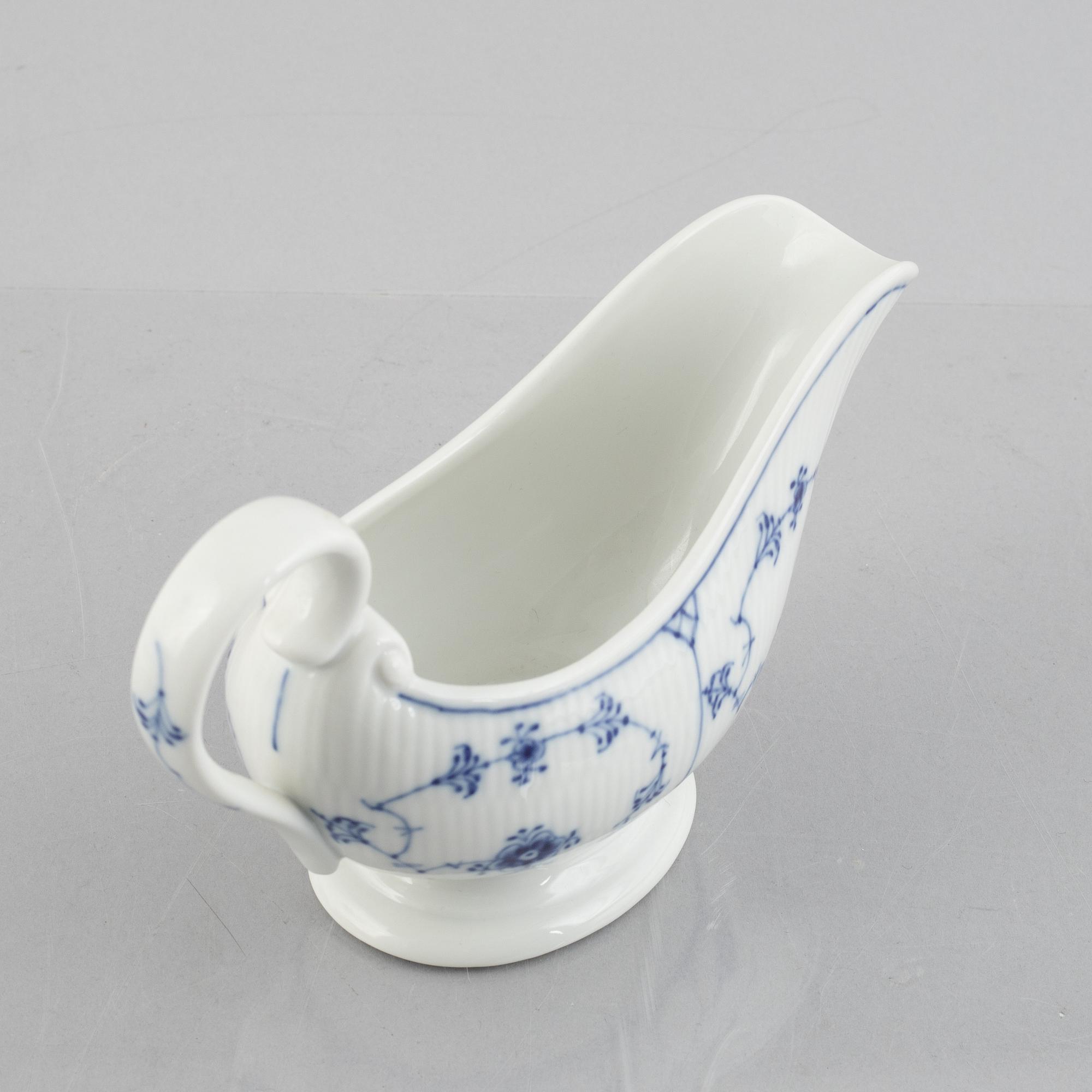 A 'Blue Fluted Plain' /'Musselmalet' sauce boat with stand, Royal Copenhagen, model 406 and 409, 1963 and 1893-1900.