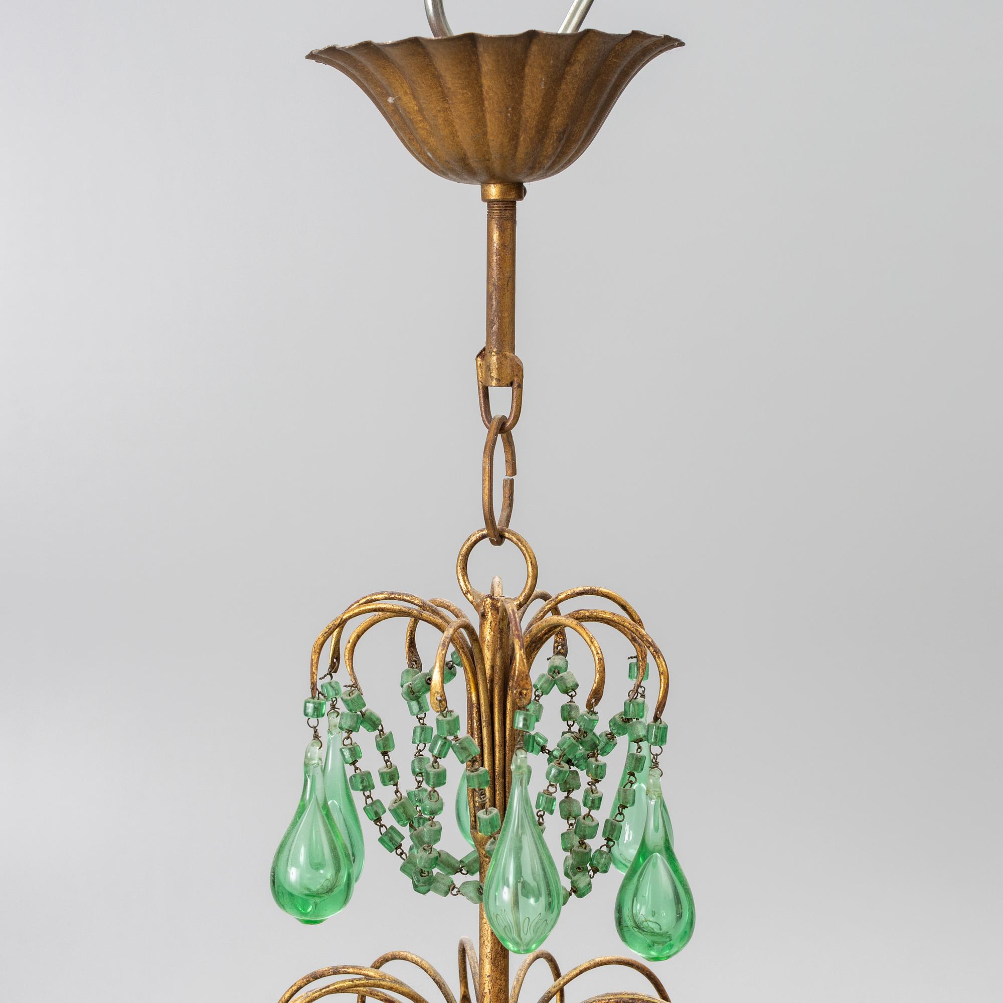 A chandelier, likely from Italy, circa 1950.