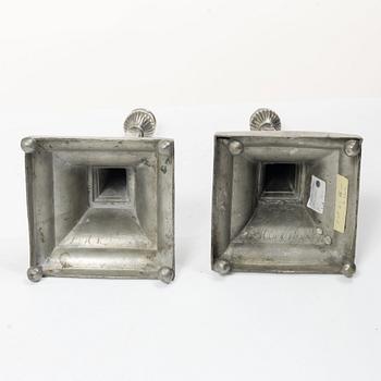 A pair of peuter candlesticks by Petter Höijer, Örebro (1796-1819).