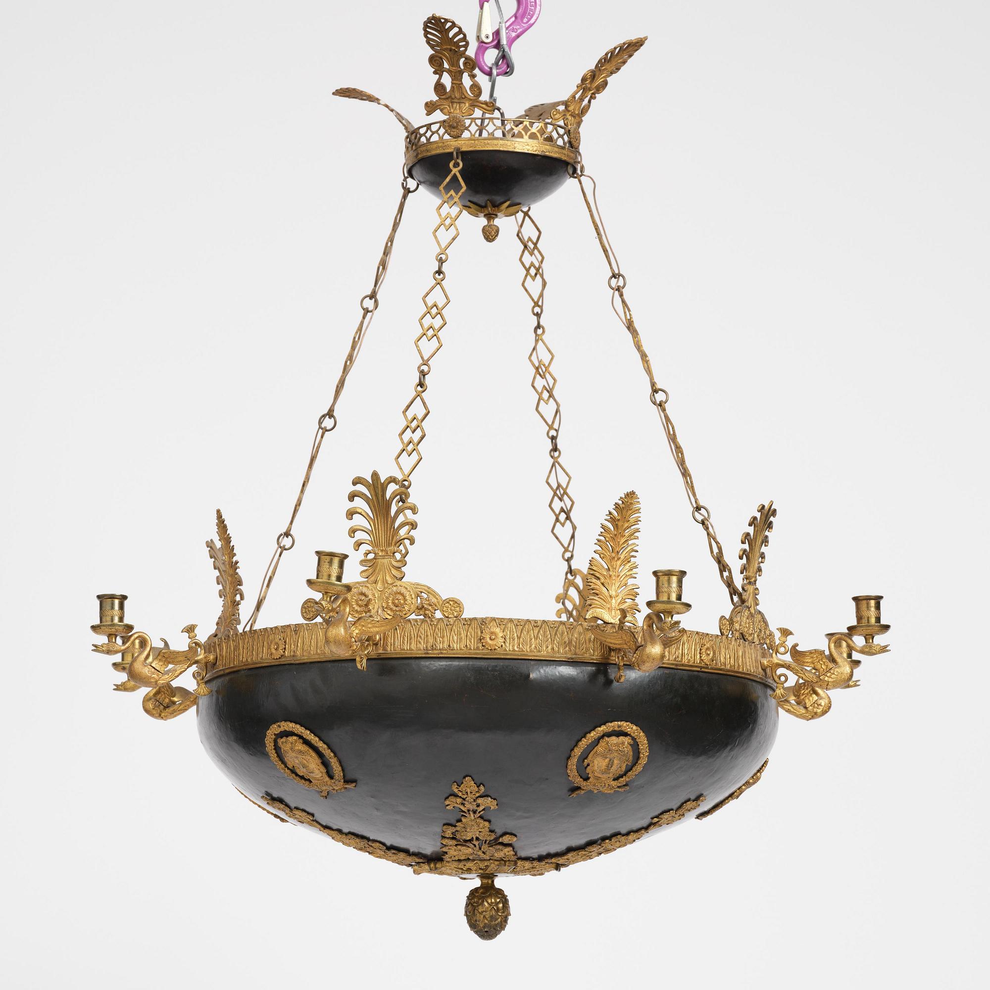 A presumably Russian Empire gilt and patinated bronze nine-branch chandelier, 19th century.