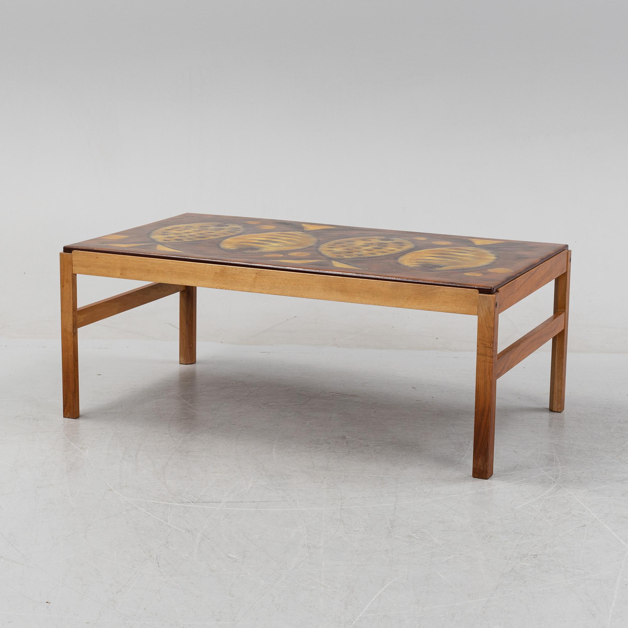 A walnut coffee table, 1960's/1970's, signed Baco.