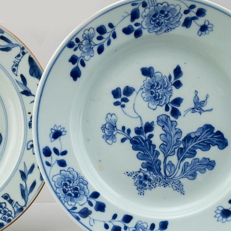 Four blue and white export porcelain plates, three soup plates and a serving dish, Qing dynasty, Qianlong (1736-95).