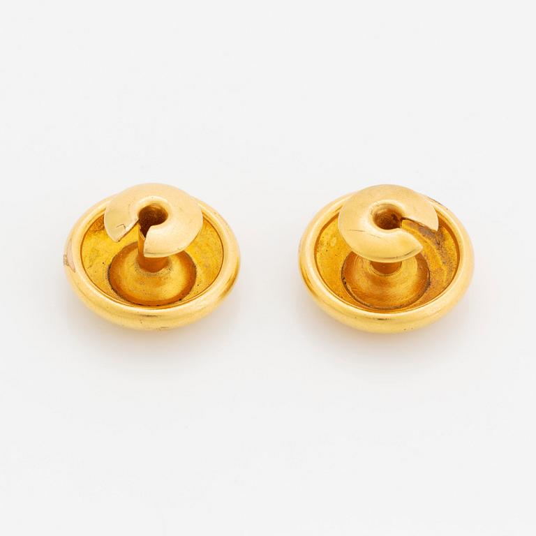 A pair of 18K gold cufflinks set with old-cut diamonds.