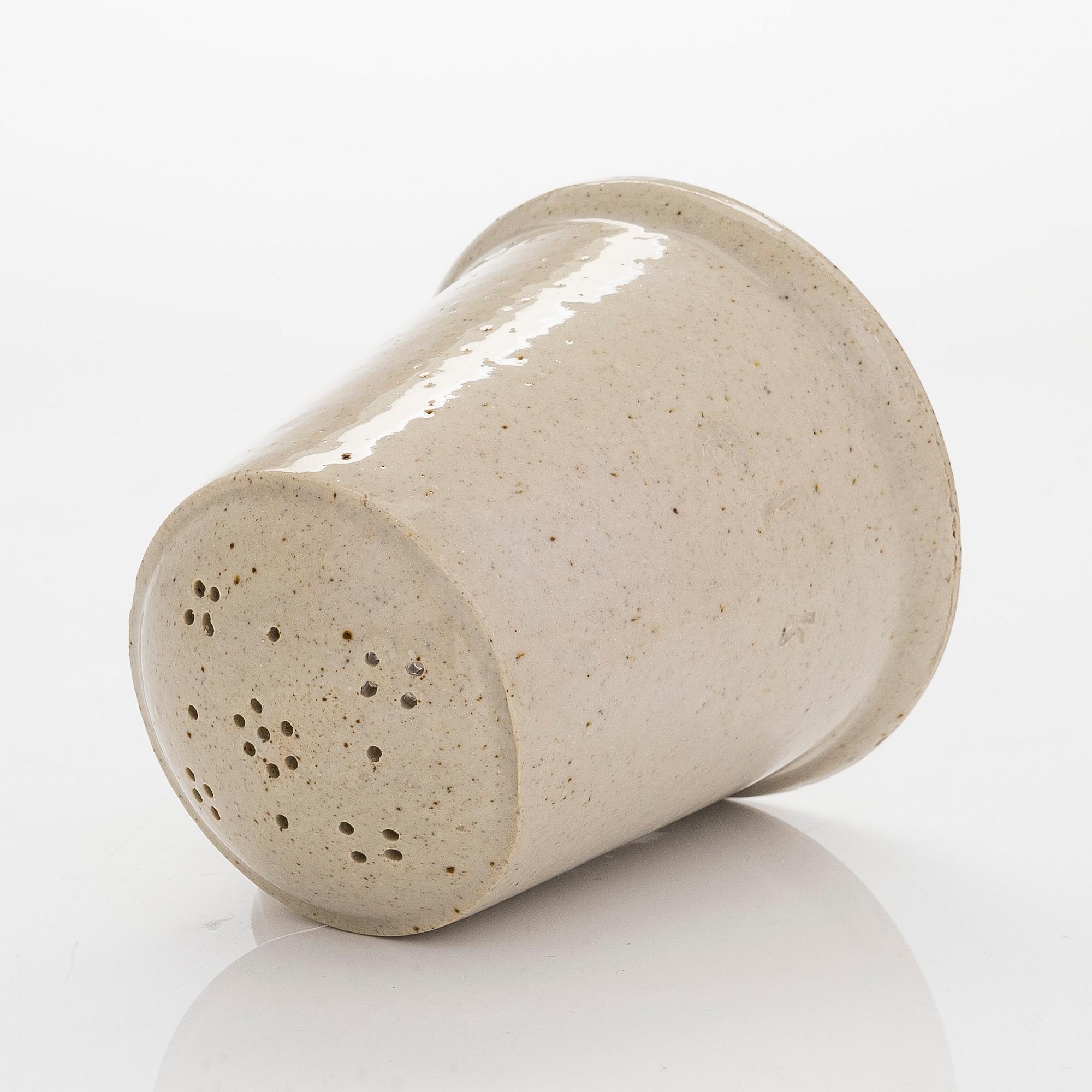 Kyllikki Salmenhaara, a stoneware tea strainer signed KS.