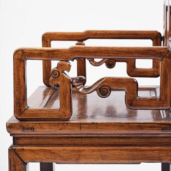 A pair of hardwood armchairs, late Qing dynasty.