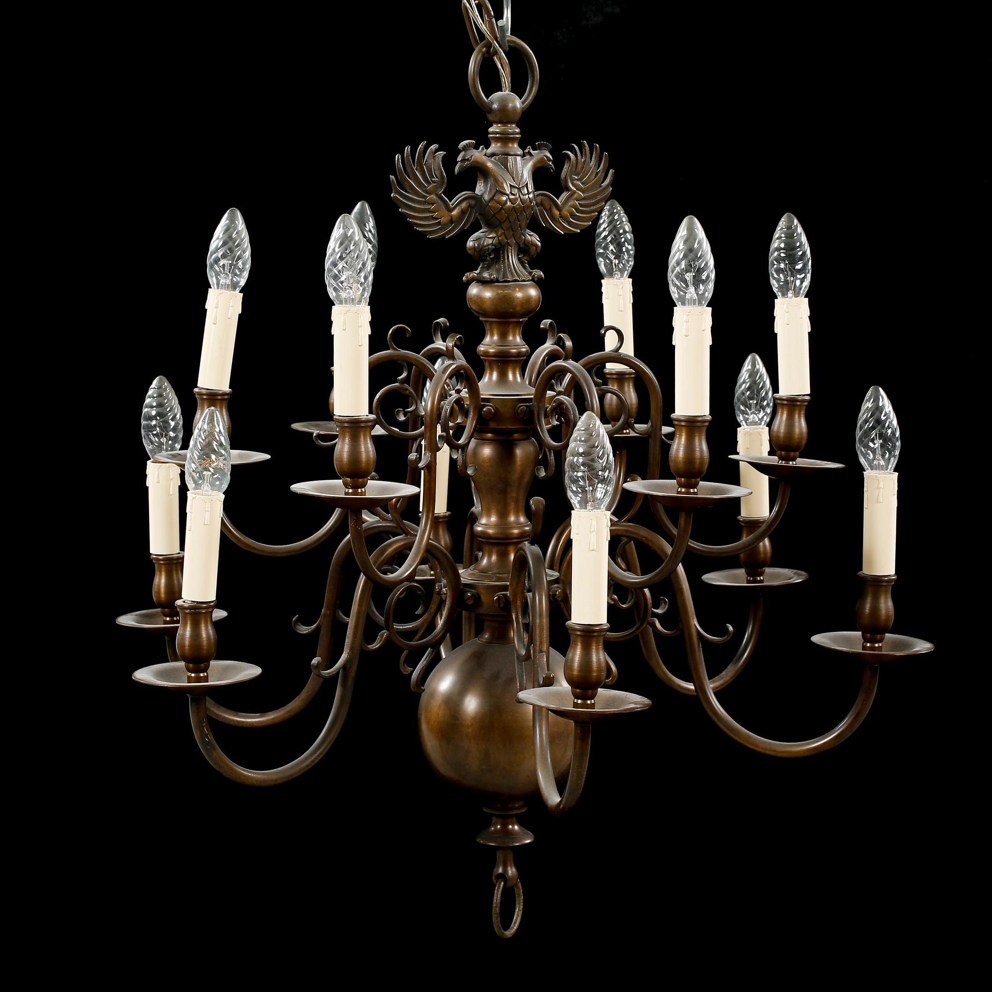 A patinated brass chandelier, first half of the 20th century. Height excl. chain ca 75 cm.