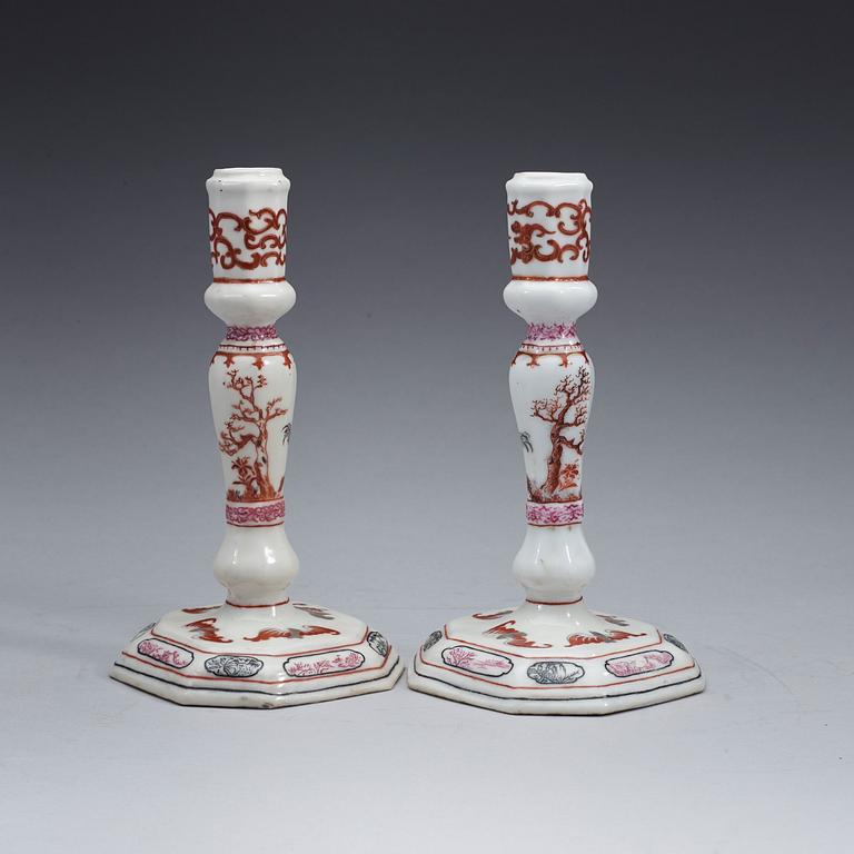 A pair of famille rose candle sticks, Qing dynasty, Qianlong (1736-95).