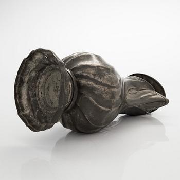 A mid 18th century rococo pewter jug.