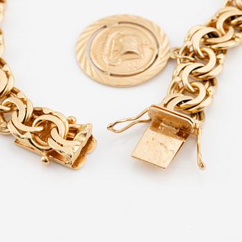 Bracelet, 18K gold Bismarck link, with charm.