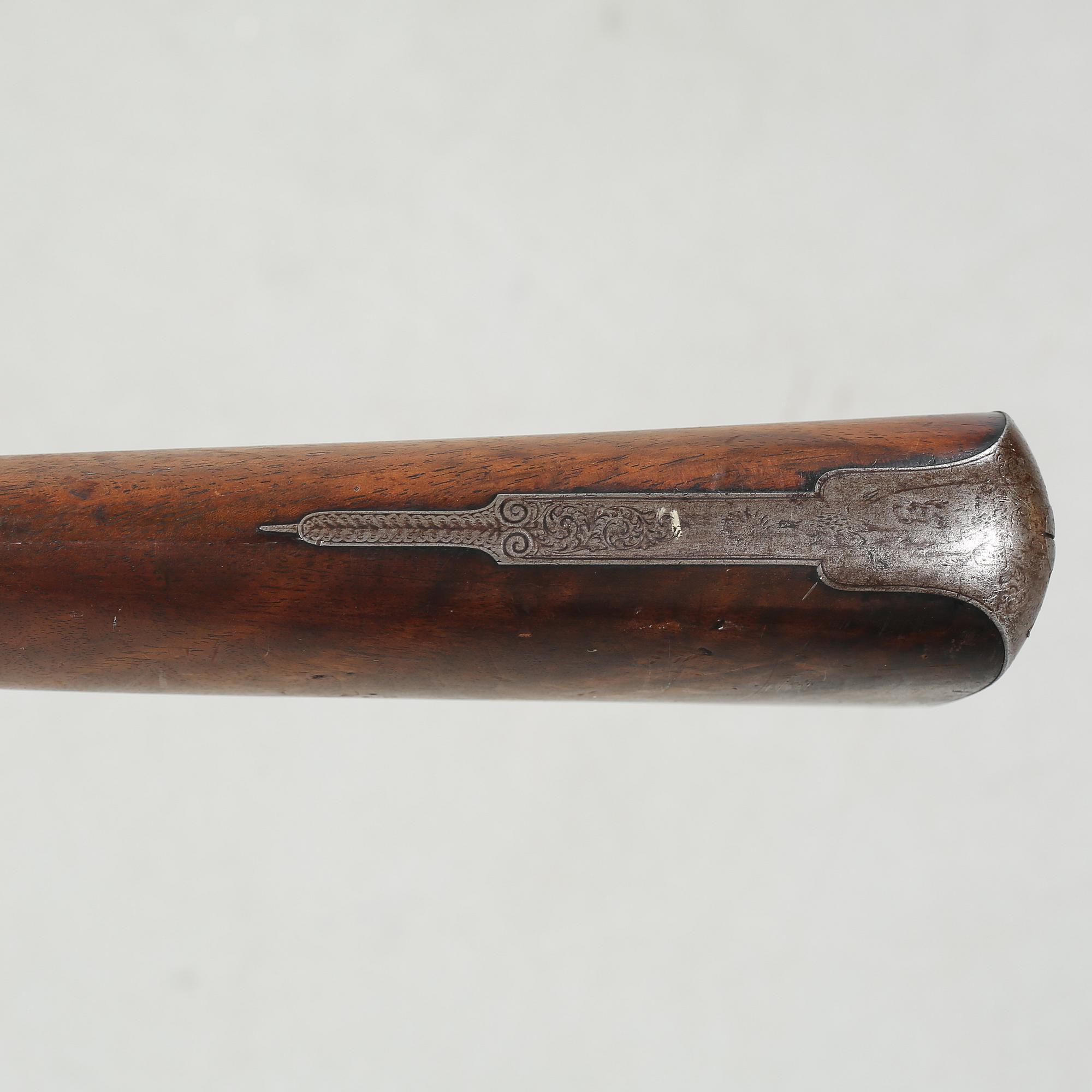 A percussion rifle by Charles William Lanchester in London, around the mid 19th century.
