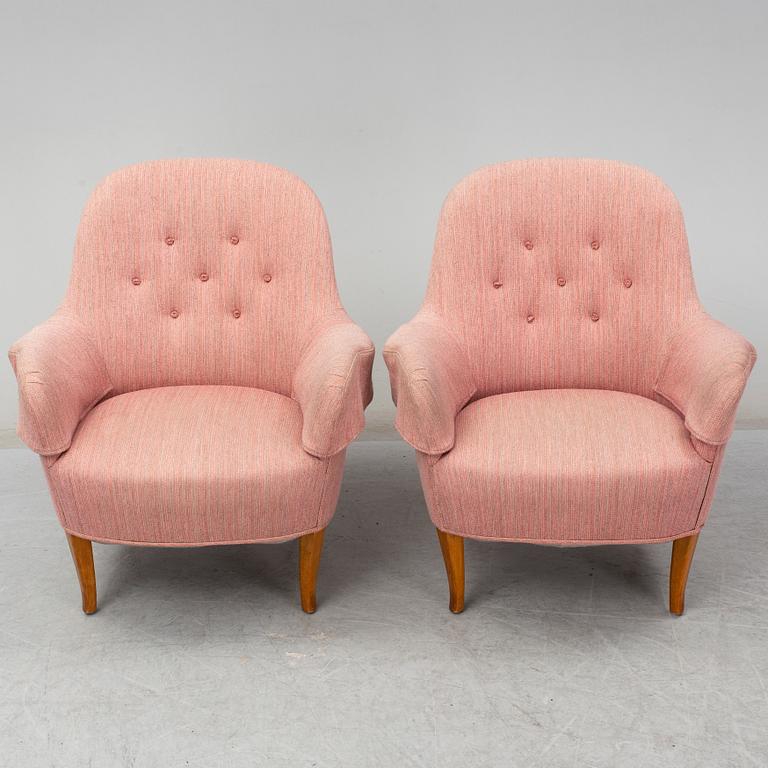 A pair of second half of the 20th Century 'Cirkus' easy chairs by Carl Malmsten.