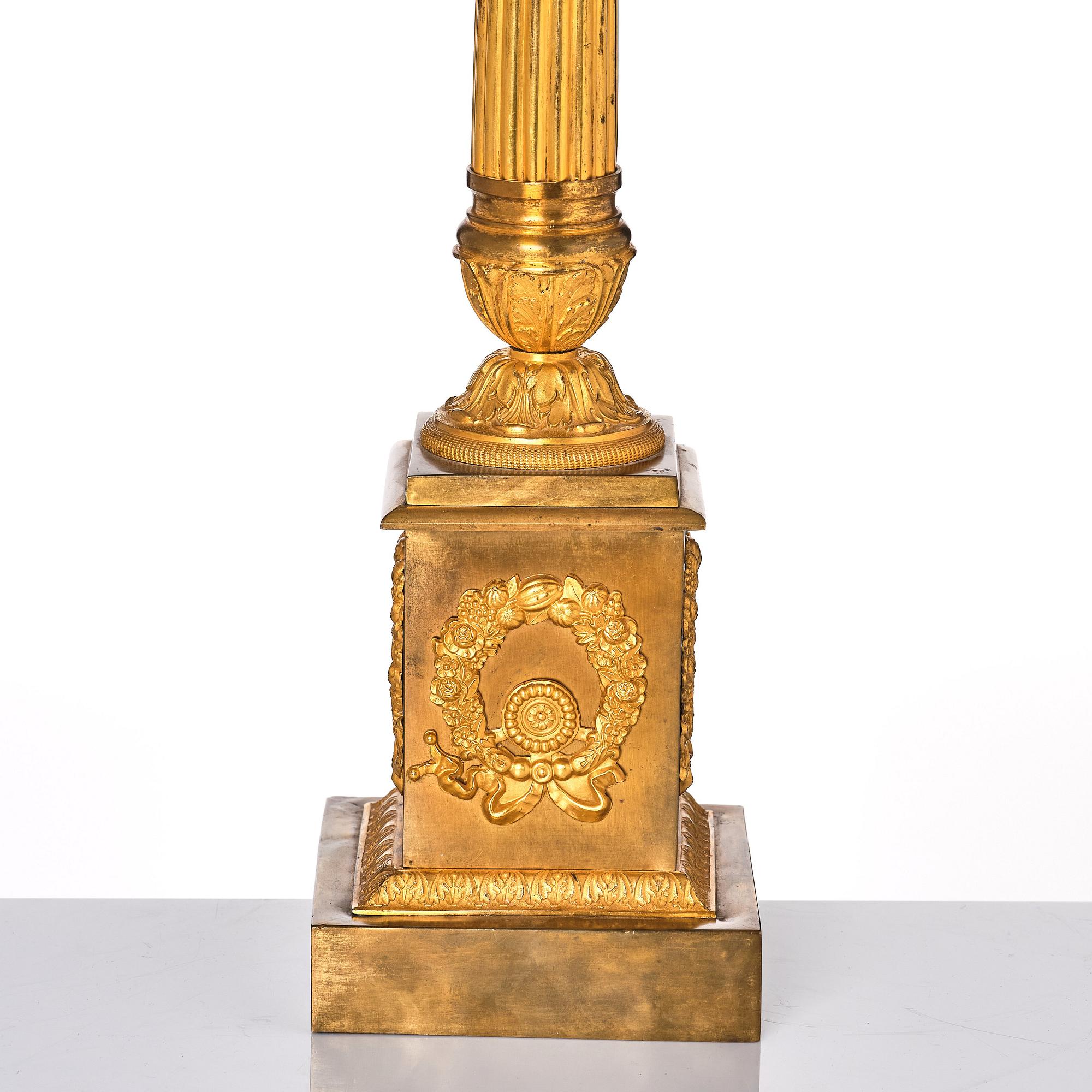 A French late Empire gilded six-light candelabra, mid 19th century.