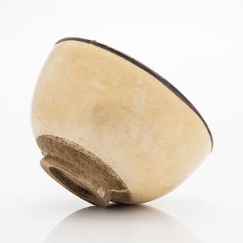 A creme glazed bowl, presumably Song/Yuan dynasty.