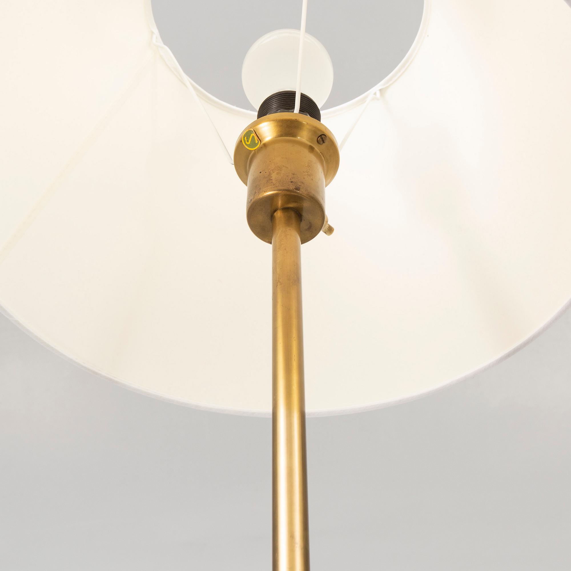A pair of brass floor lamps from NK (Nordiska Kompaniet) later part of the 20th century.