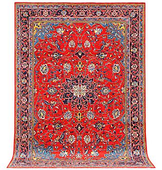 A Hamadan carpet, a. 320 x 220 cm.