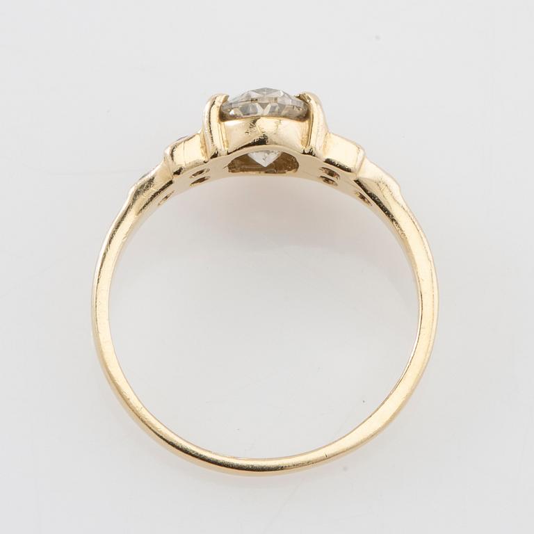 Ring 14K gold with an oval faceted diamond approximately 1.23 ct and round brilliant-cut diamonds.