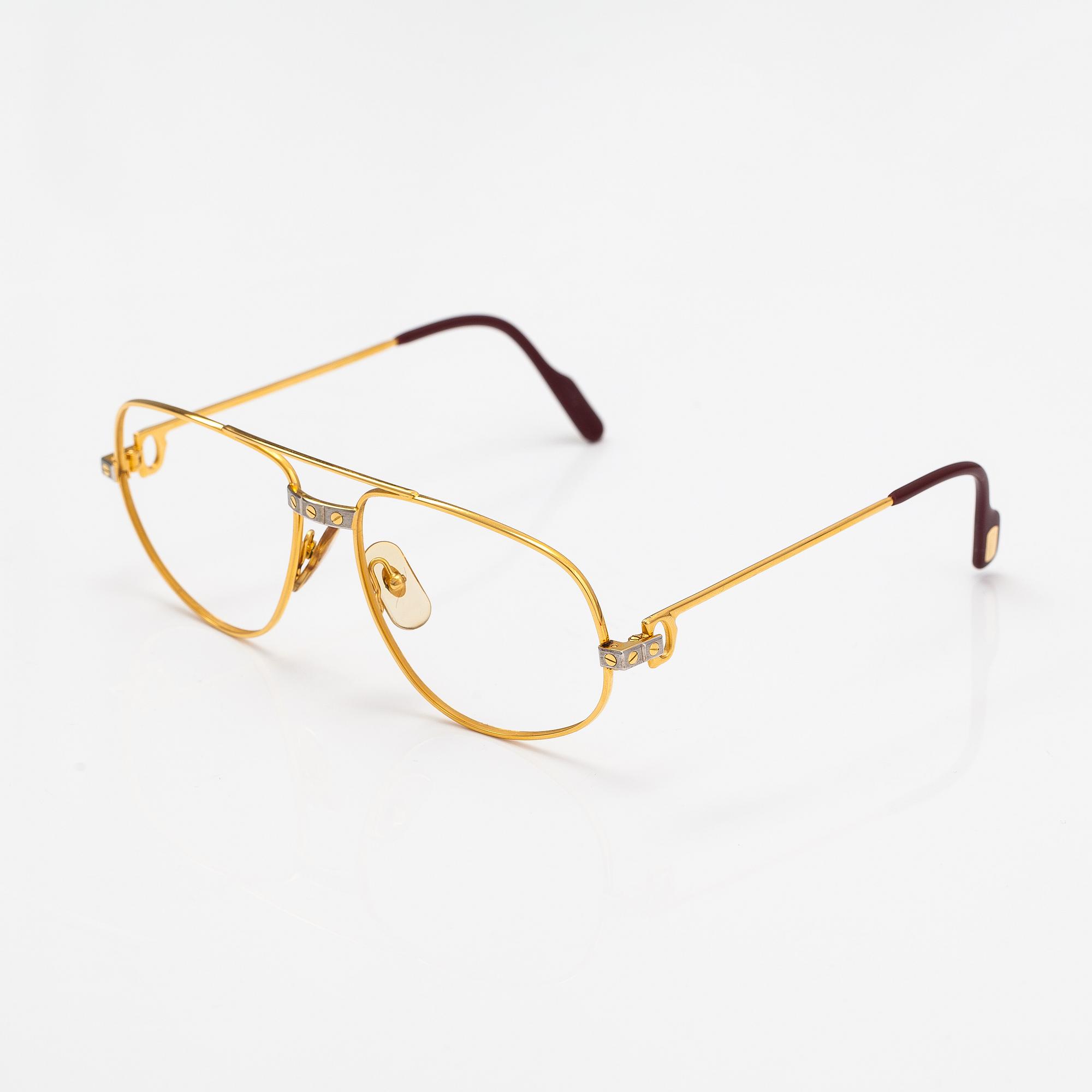 must de Cartier, Santos, a pair of eyeglass frames. Marked Cartier, Paris, Made in France 135, 56, 16.