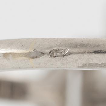 Platinum ring with sapphire and old-cut diamonds.