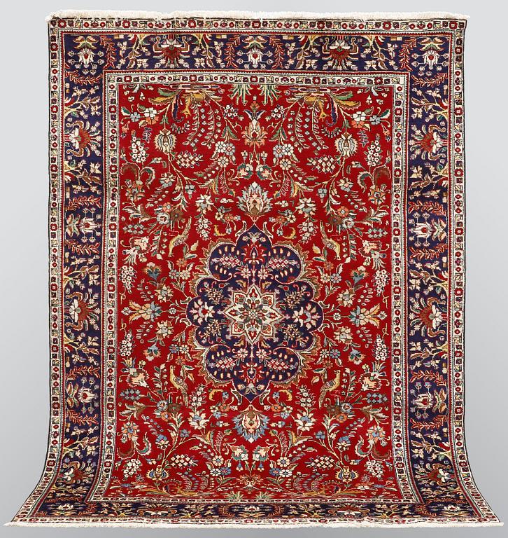 A carpet, Figural Tabriz, ca 310 x 220 cm.