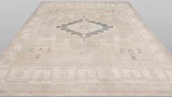 An oriental carpet, ca 312 x 256 cm.