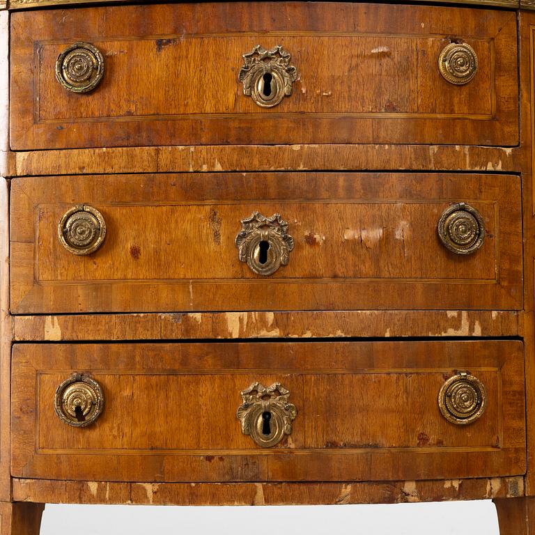 A Louis XVI style chest of drawers, 19th century.