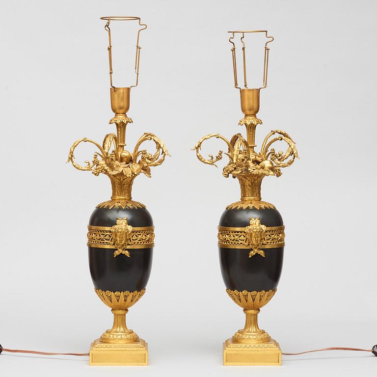 A pair of gilt and patinated bronze table lamps signed and dated by Henry Dasson 1877.