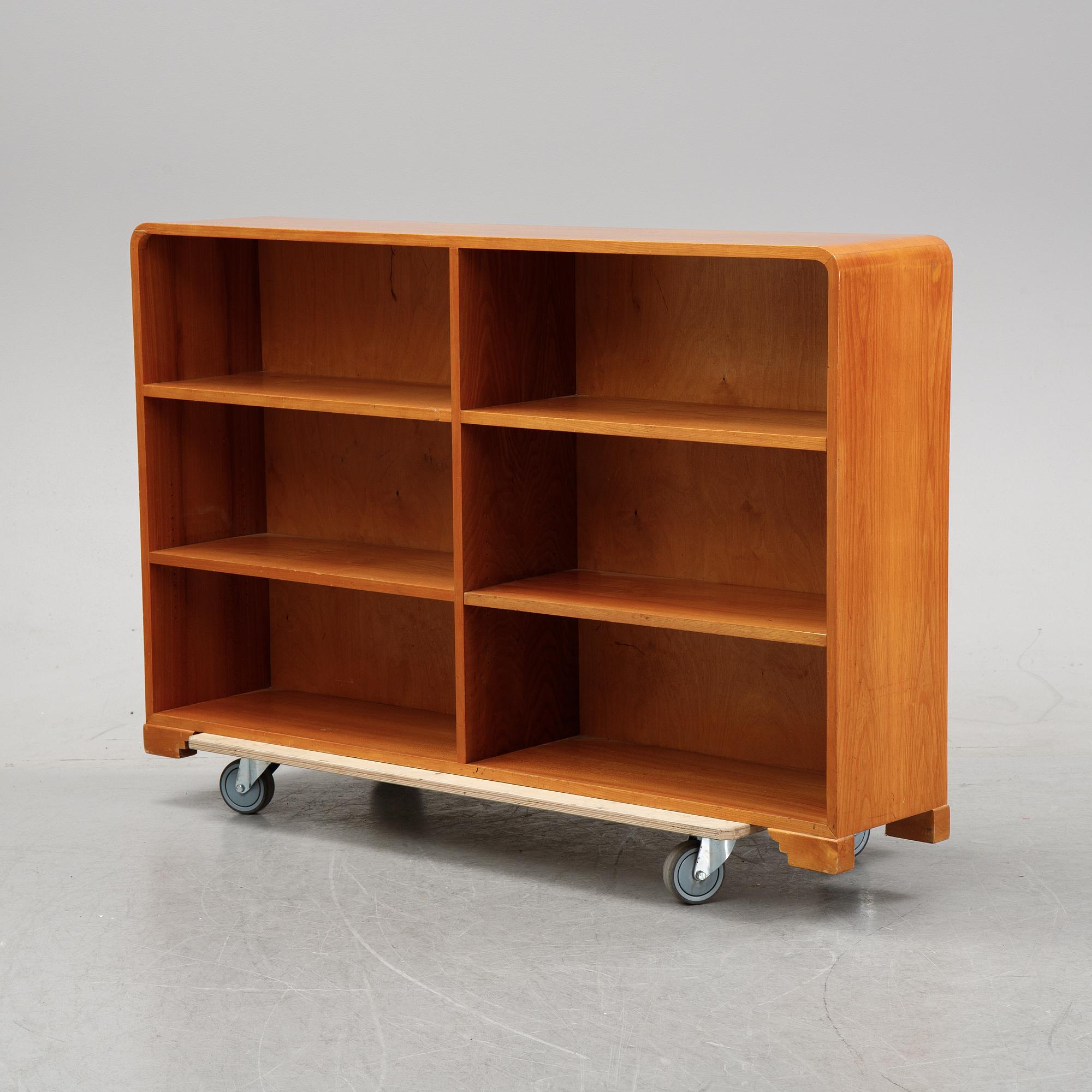 A mid 20th Century elm wood book case.