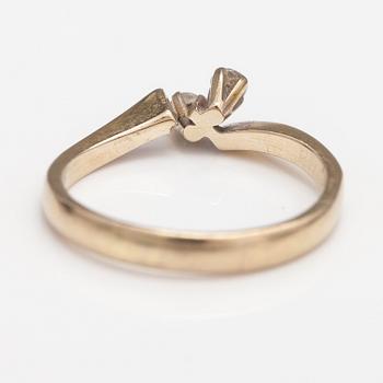 An 18K gold ring with diamonds ca. 0.12 ct in total. Finland 1974.