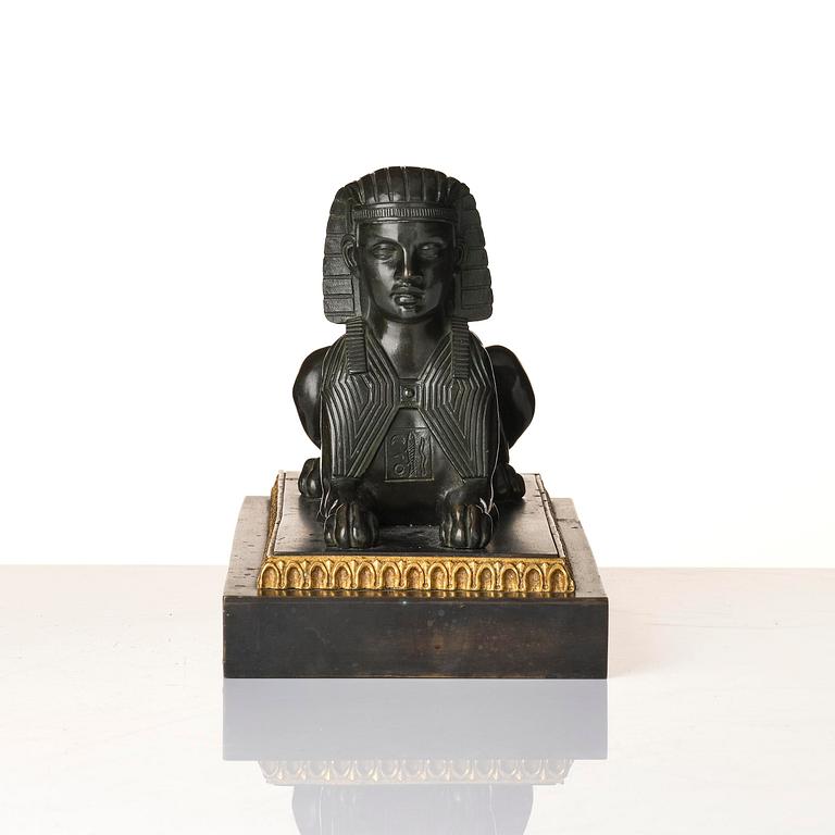 A French Empire bronze sfinx.