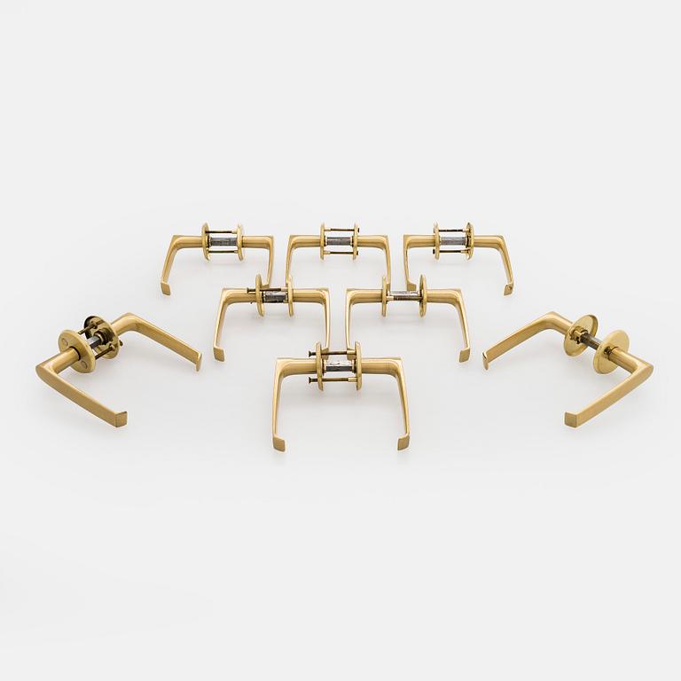 A set of eight 1960s-70s door handles.