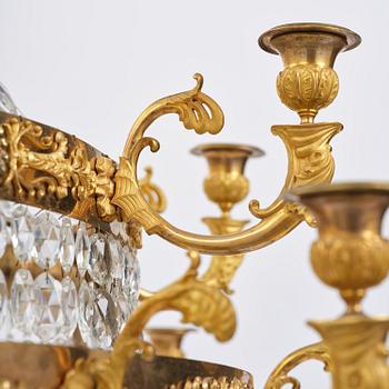 An ormolu and cut glass sixteen-branch Empire chandelier, Paris, early 19th century.