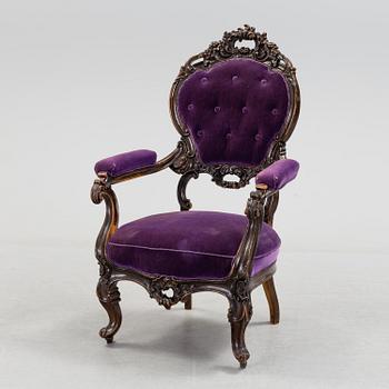 a rococo-style armchair from the second half of the 19th century.