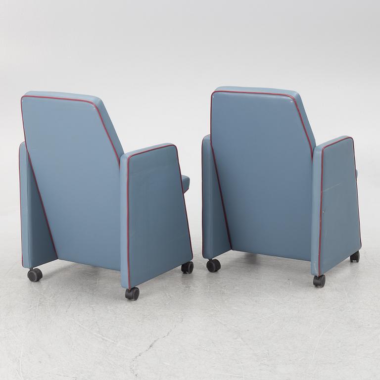 A pair of 1980s armchairs.
