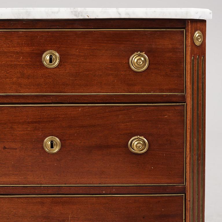 A late Gustavian mahogany, brass-mounted and marble-top commode by C. G. Foltiern (master in Stockholm 1804-29).