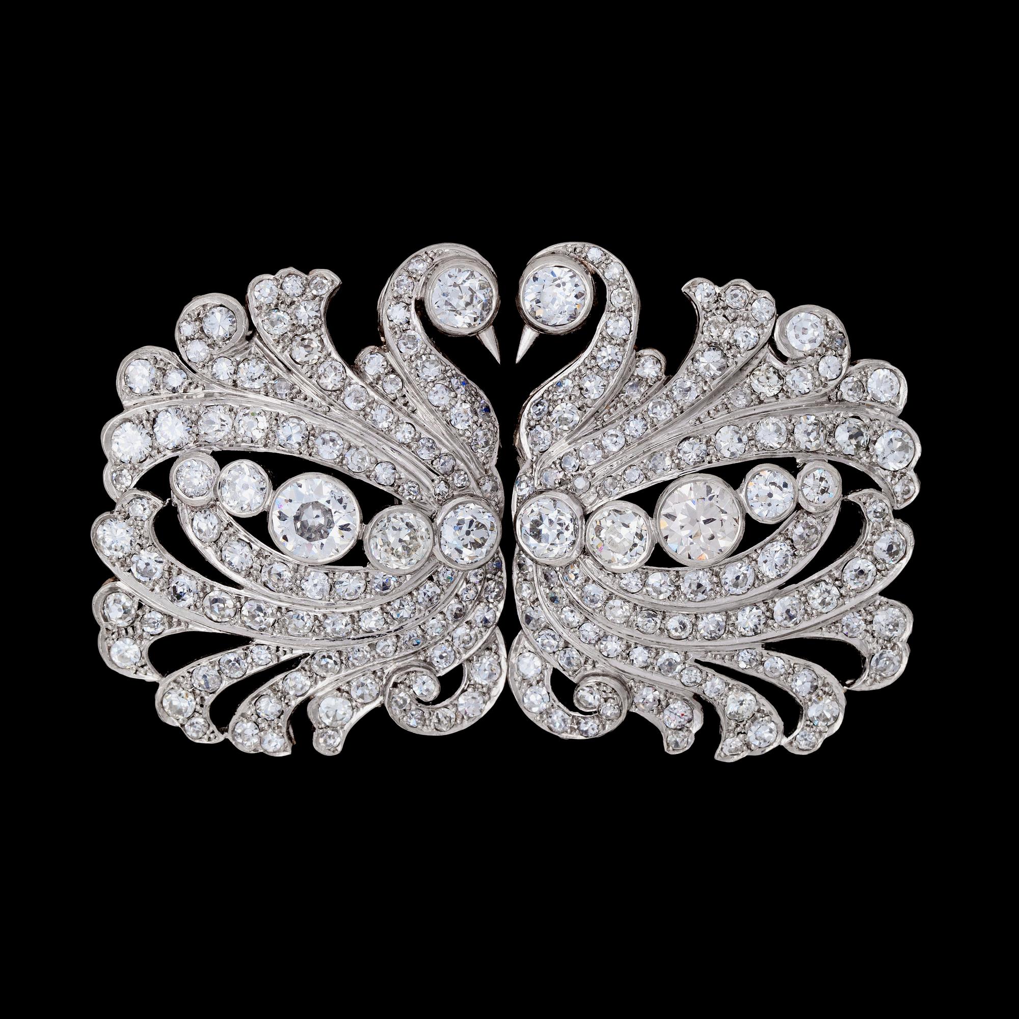 A diamond double clip brooch, tot. app. 20 cts. 1930-40's.