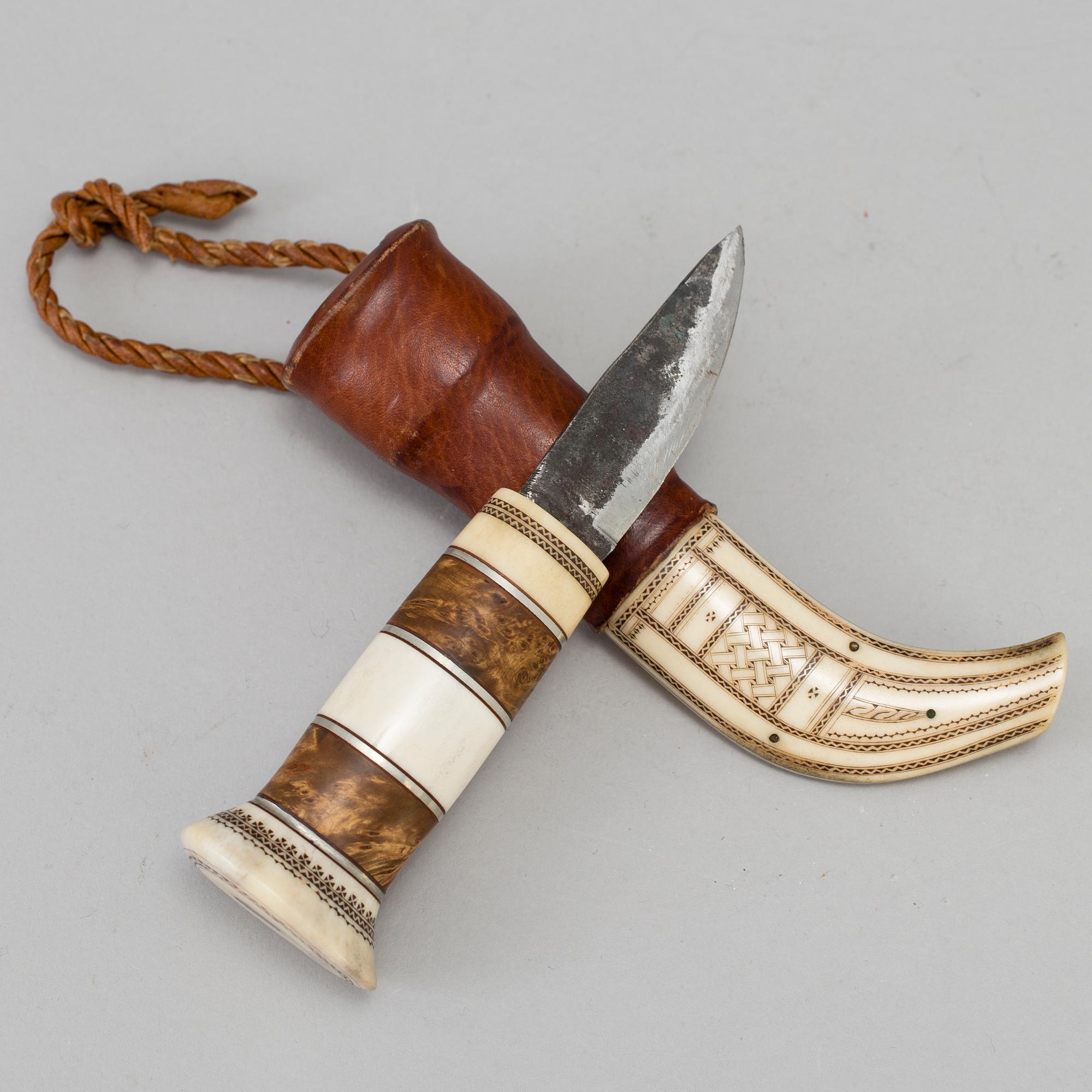 A traditional sami knife. Signed with unknown signature.