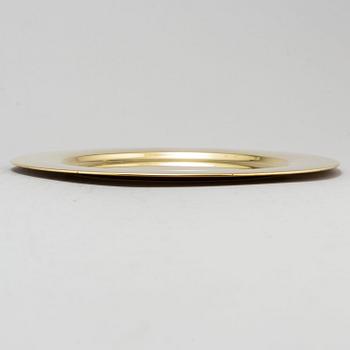 Eight brass plates by Stelton, Denmark, second half of the 20th century.
